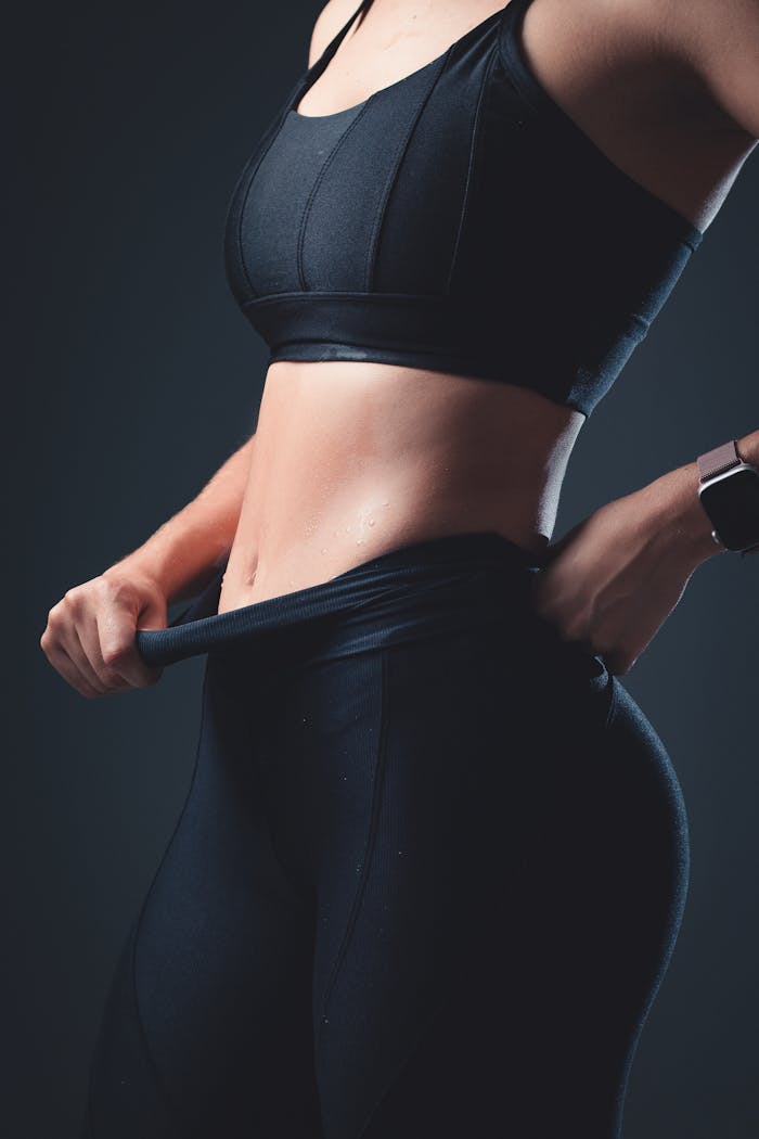 Close-up of a fit woman in sportswear showcasing active lifestyle and fitness.